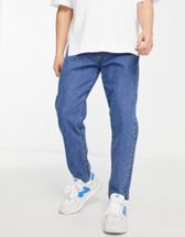 ASOS DESIGN stretch tapered jeans in retro mid wash blue