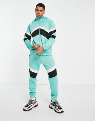Another Influence retro matchday tracksuit set in turquoise