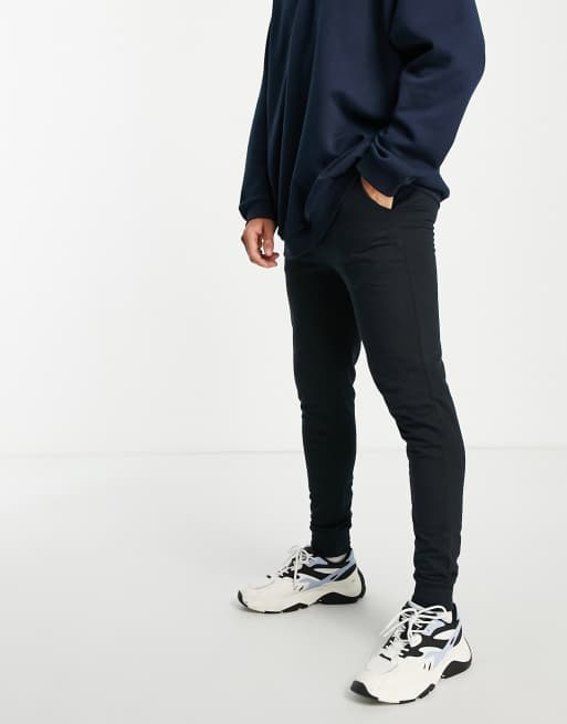 Another Influence – Schmal geschnittene Jogginghose in Schwarz