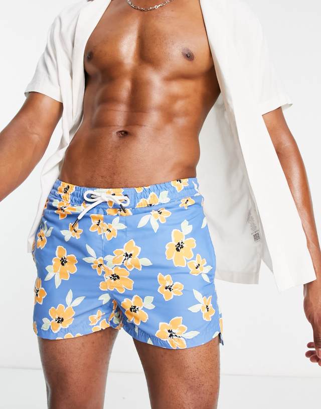 Another Influence swim shorts in blue and orange flower print