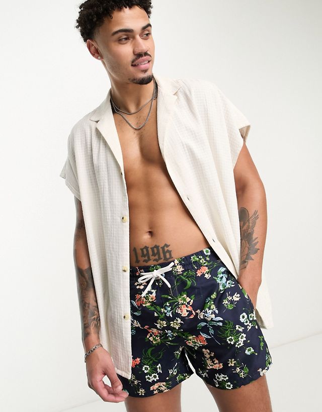 Another Influence swim shorts in navy floral print