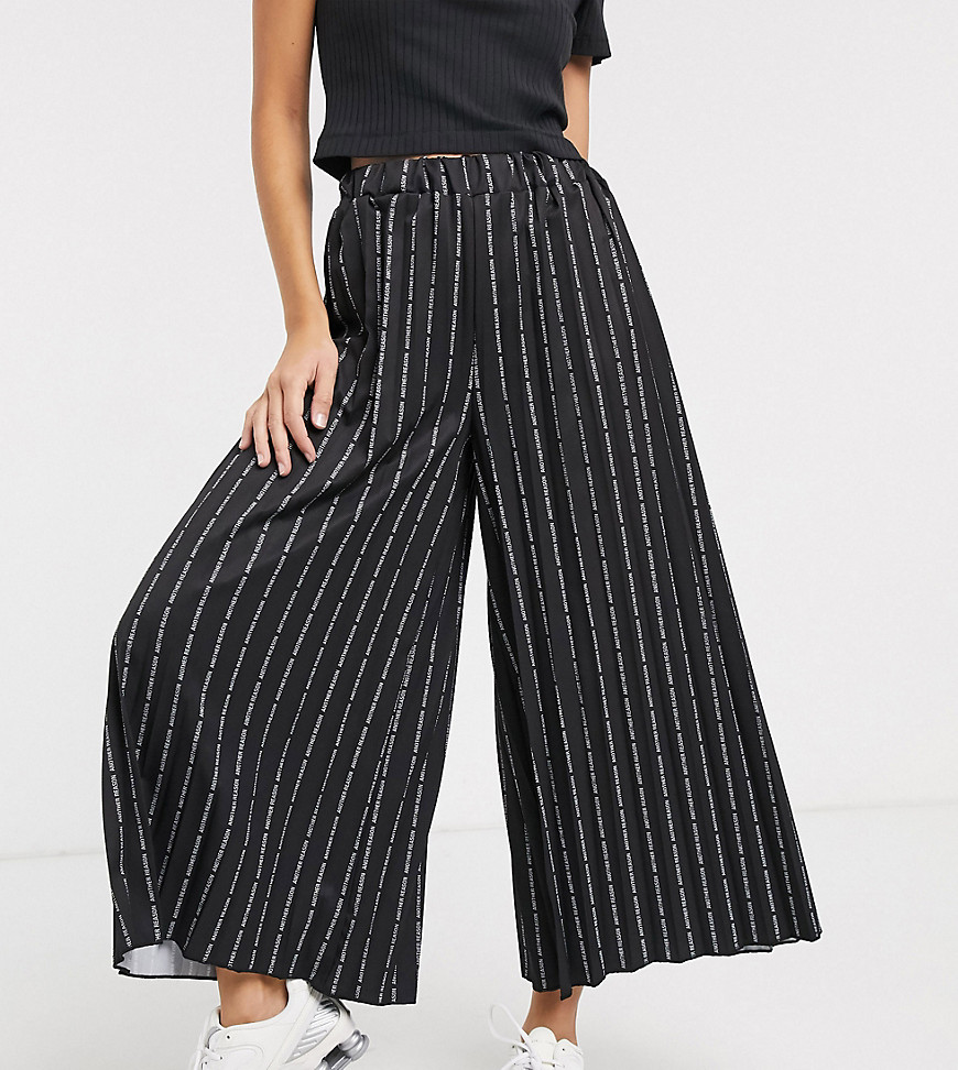 Another Reason relaxed pleated trouses in repeat text print-Black