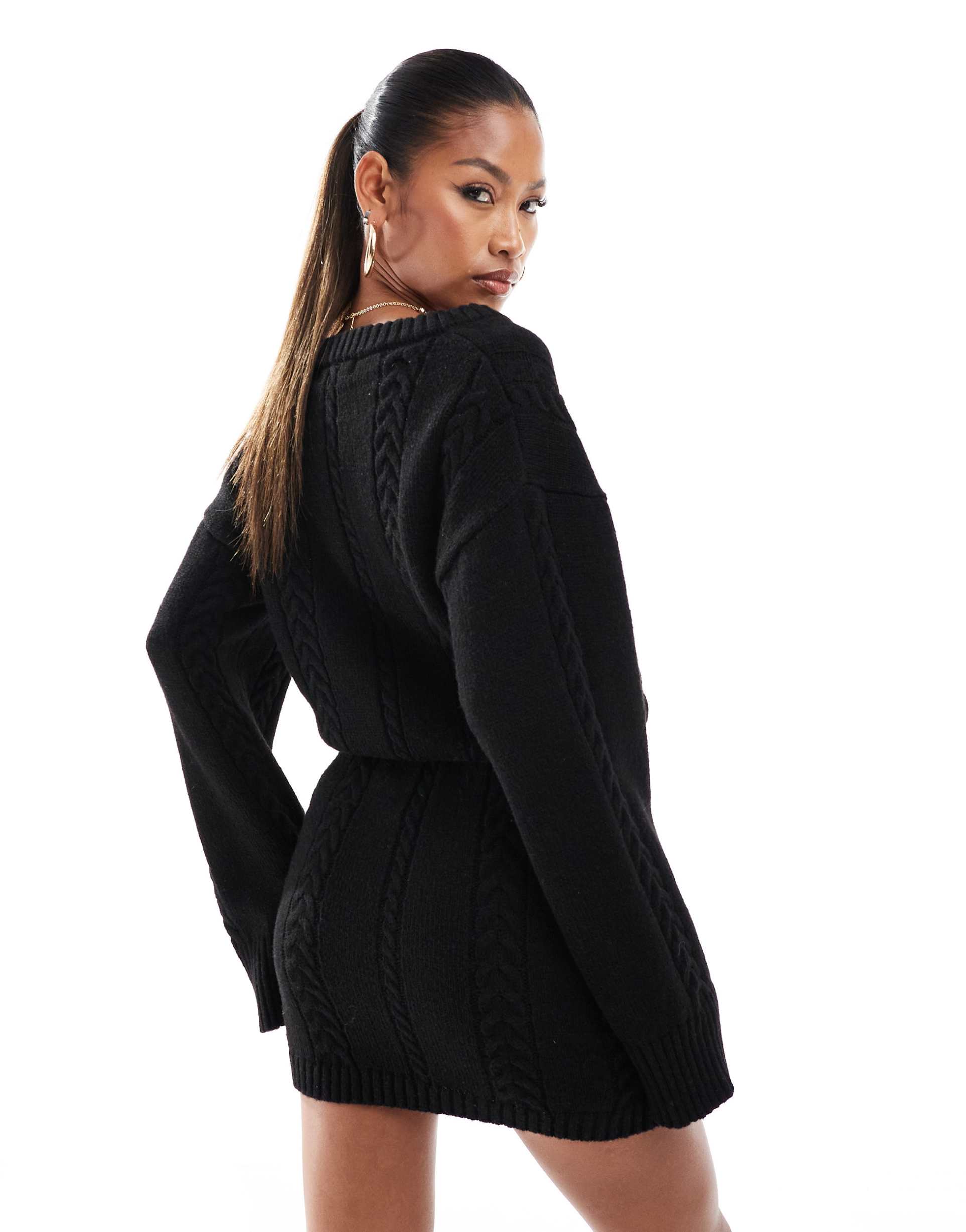 aria cove cable knit v neck mini sweater dress in black