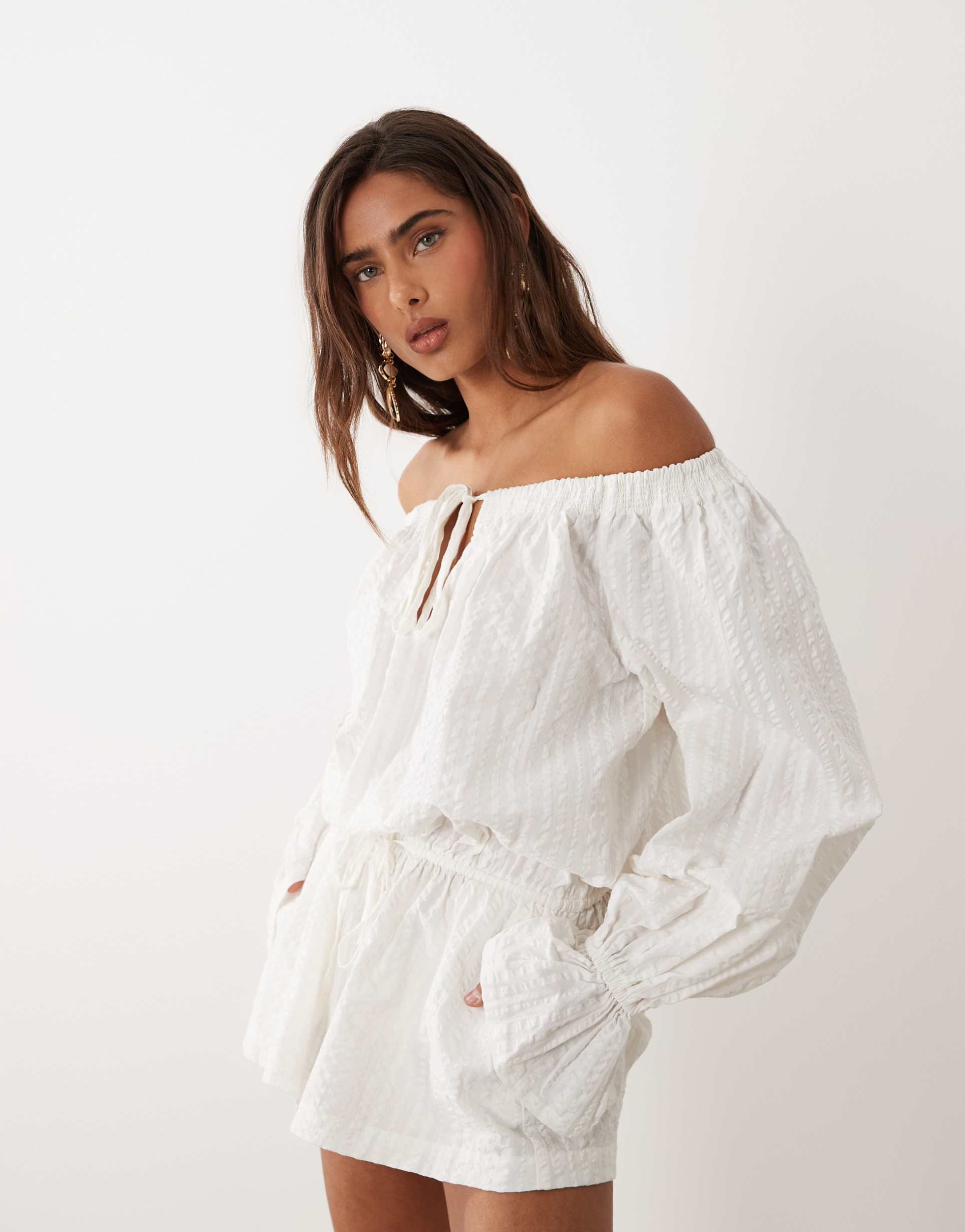 aria cove cotton bardot tie front detail flare sleeve romper in white