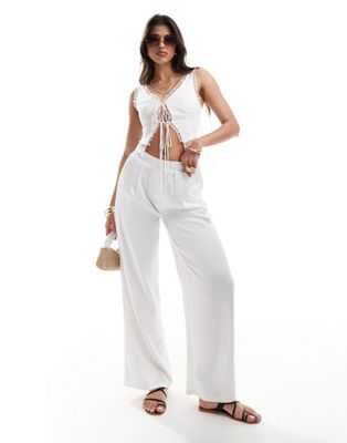 satin wide leg pants in white - part of a set