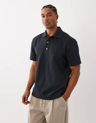 cotton rich short sleeve waffle knit polo shirt in off black