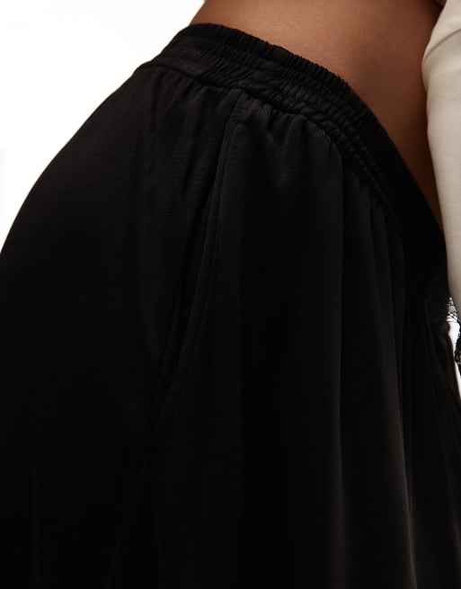 ARKET - Glanzende broek met elastische taille en ballonpijpen in zwart, 3 van 5