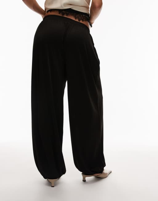 ARKET - Glanzende broek met elastische taille en ballonpijpen in zwart, 4 van 5