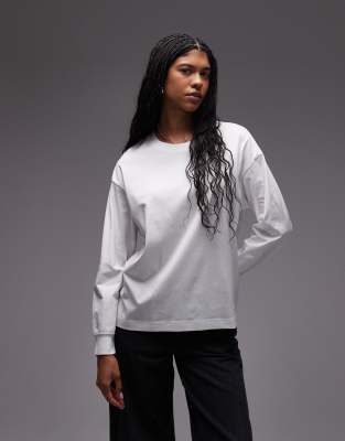 ARKET - Langärmliges Jersey-T-Shirt in Weiß mit lockerem Schnitt und breiten Bündchen