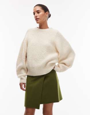 Mini-jupe en laine majoritaire effet portefeuille avec bouton - Vert mousse 44