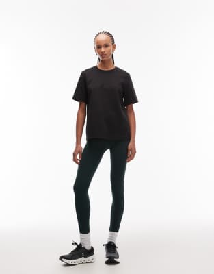 ARKET - Nahtlose Sport-Leggings in Dunkelgrün mit Seitentaschen