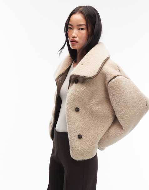 ARKET oversized faux shearling jacket in light beige with brown contrast edging - view 1