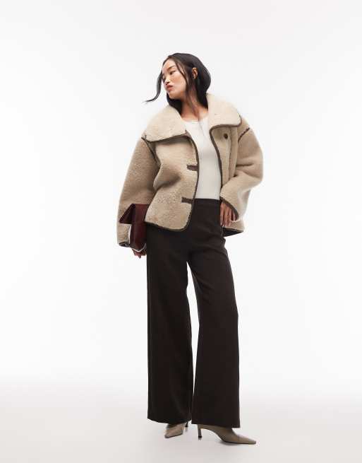 ARKET oversized faux shearling jacket in light beige with brown contrast edging 