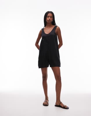 pure linen beach romper with deep v-neck and pocket detail in black