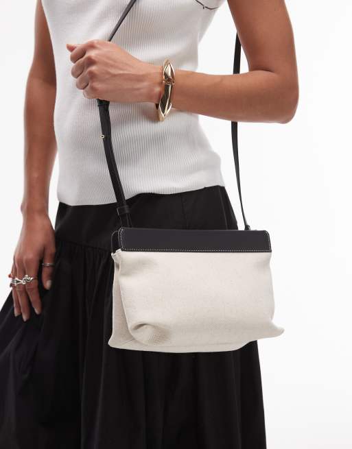ARKET small canvas cross body bag with black leather details contrast stitches in light white neutral, 2 of 4