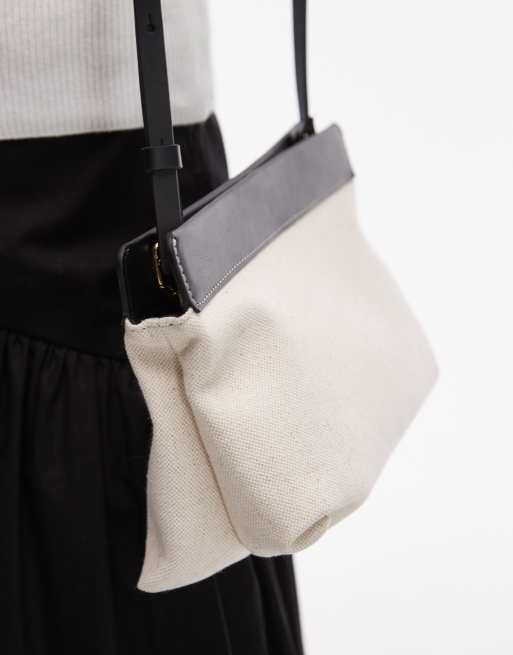 ARKET small canvas cross body bag with black leather details contrast stitches in light white neutral, 3 of 4