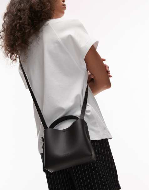 ARKET small leather cross body tote bag with side buckle detail in black - view 1