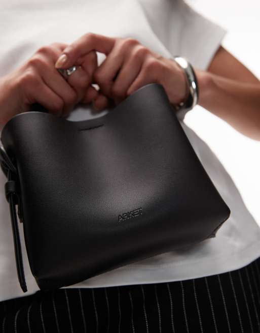 ARKET small leather cross-body tote bag with side buckle detail in