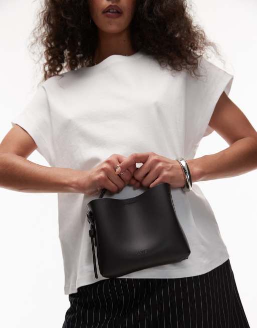 ARKET small leather cross-body tote bag with side buckle detail in