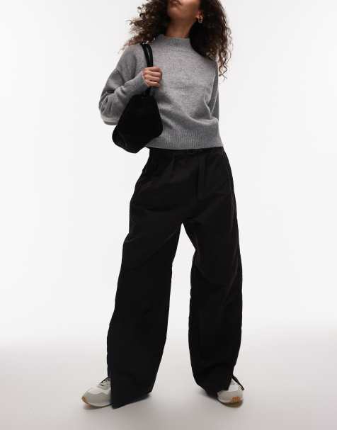 ARKET tech nylon baggy trousers with zip hem detail in black - view 1