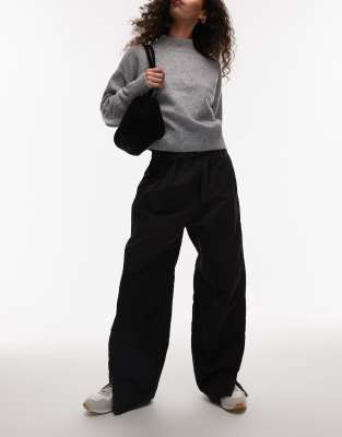Arket Tech Nylon Baggy Utlility Pants With Zippered Hem Detail In Black