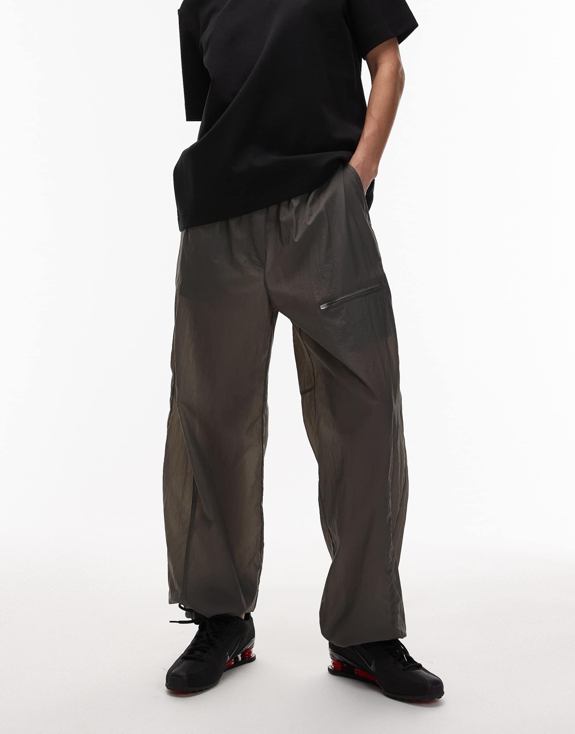 arket utility parachute pants in dark gray