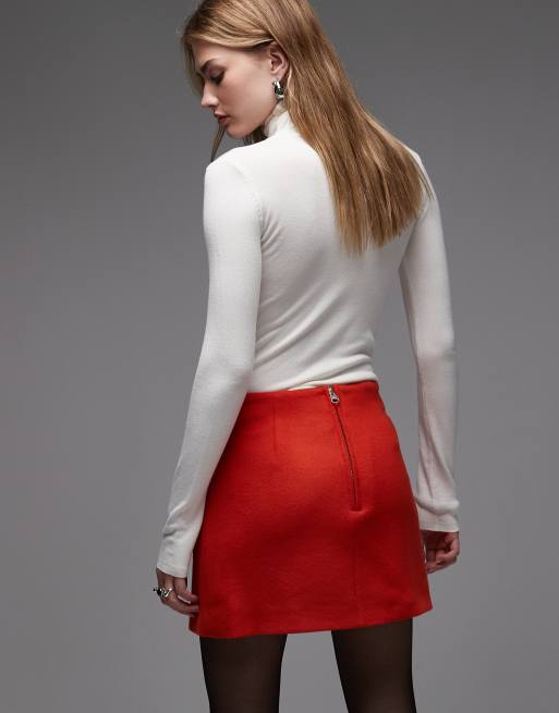 ARKET wool rich mini skirt with front pockets in orange