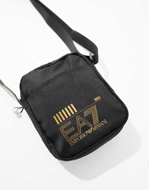 Armani EA7 core logo slim reporter bag in black gold ASOS