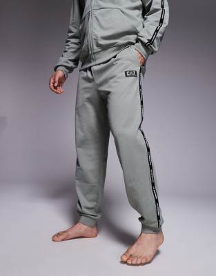 Shop Ea7 Armani  Cuffed Sweatpants With Logo Tape Detail