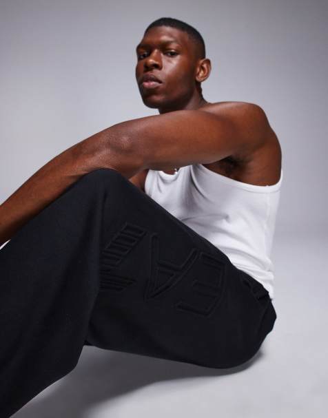Armani EA7 embossed logo joggers in black - view 1