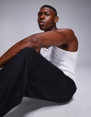 Armani EA7 embossed logo sweatpants in black