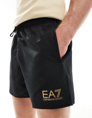 Armani EA7 gold logo swim shorts in black