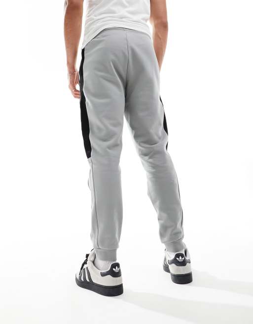 Armani EA7 Jogginghose in Grau aus Sweatshirt Stoff mit Bundchen Logo und farblich abgesetztem Zierband Kombiteil ASOS