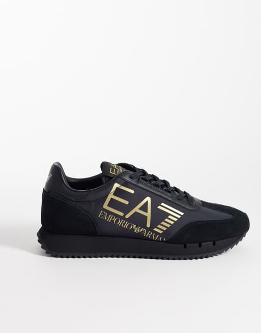 Armani – EA7 New Heritage – Sneaker in Schwarz und Gold mit Logo