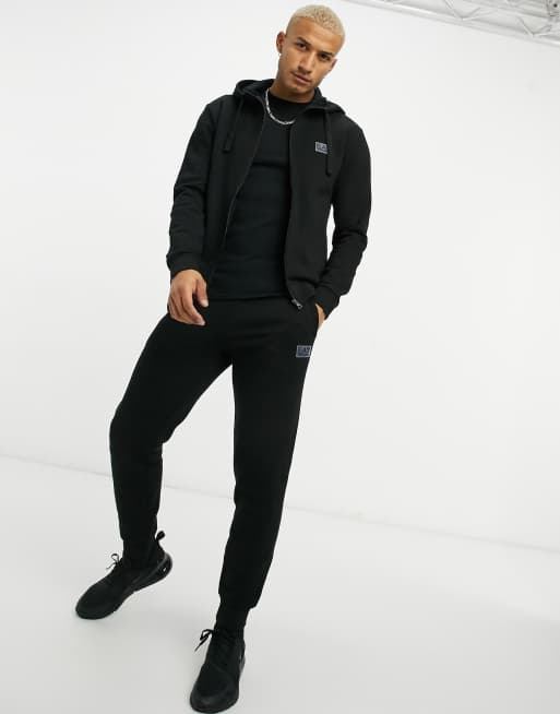 Betuttelen Zij zijn succes Armani EA7 Train Core ID rubberized logo hooded tracksuit in black | ASOS