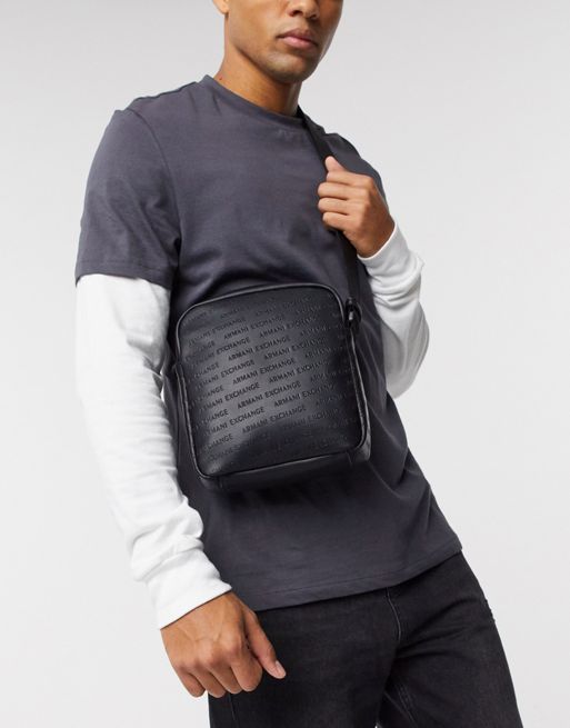 Armani Exchange all over embossed logo crossbody bag in black | ASOS