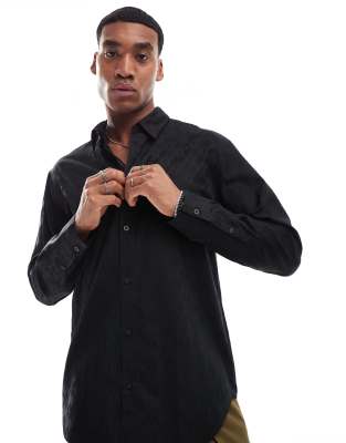 Armani Exchange all over logo printed long sleeve shirt with satin shine effect in black