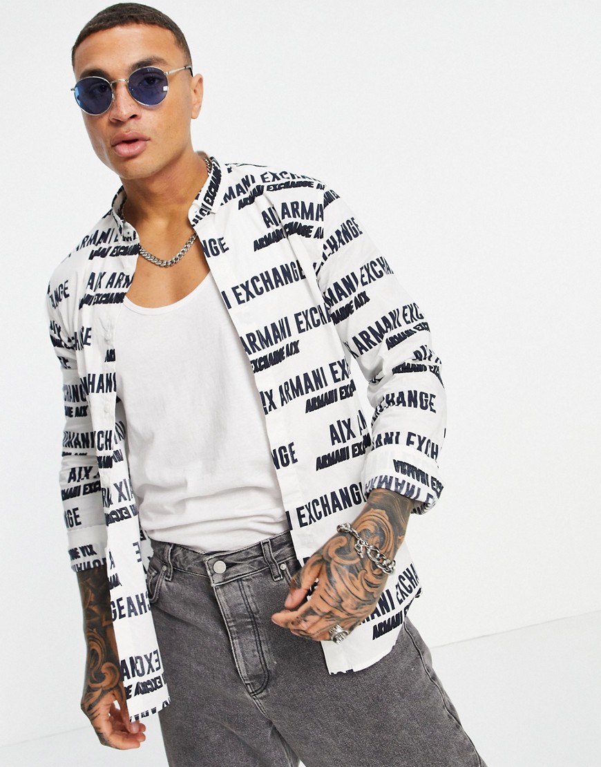 Armani Exchange all over print text logo shirt in white