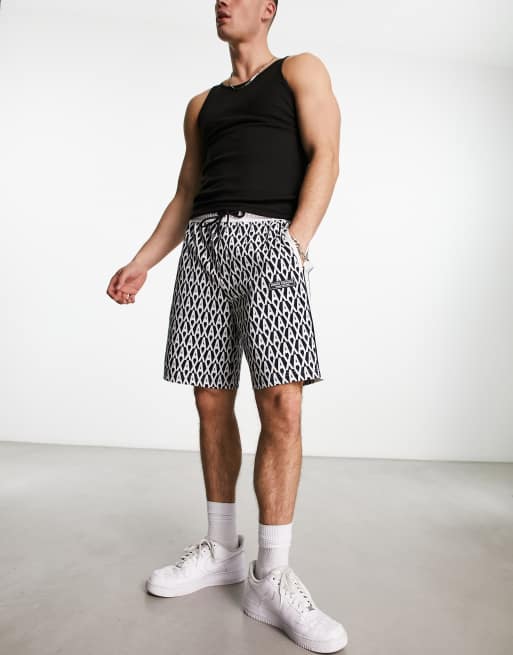 Armani Exchange allover logo jersey shorts in navy, 4 of 4