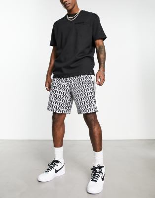 Armani Exchange allover logo jersey shorts in navy