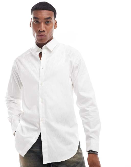 Armani Exchange - Chemise à manches longues en satin brillant avec logo sur l'ensemble - Blanc cassé