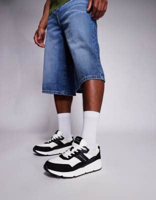 chunky suede mix logo sneakers in black and off white