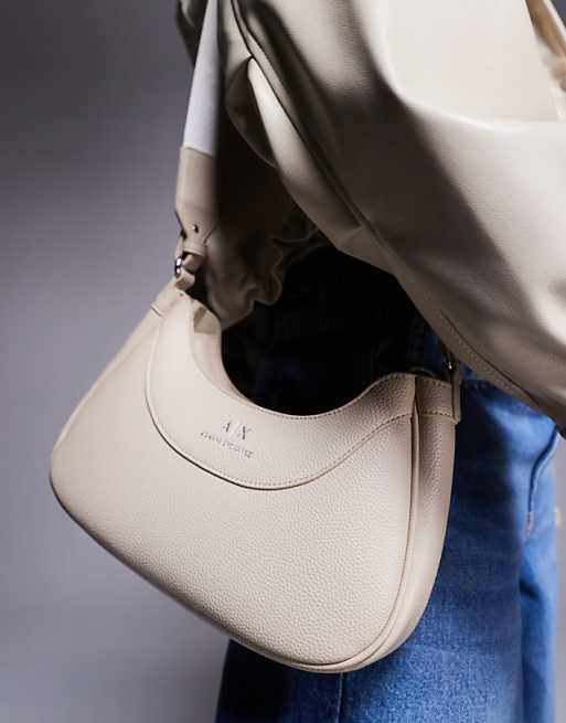 Armani Exchange curved logo shoulder bag in cream | ASOS Armani Exchange curved logo shoulder bag in cream | ASOS