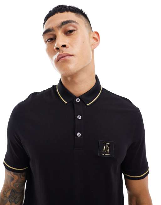 Armani Exchange gold logo and tipping pique polo in black | ASOS