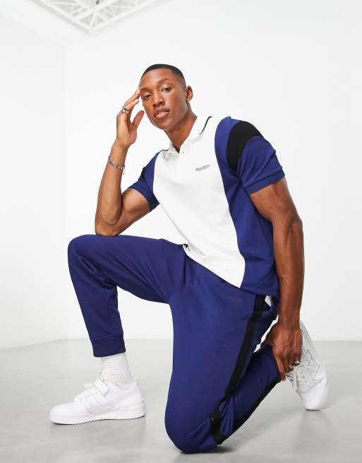 Armani Exchange – Granatowe spodnie z ozdobnymi lampasami