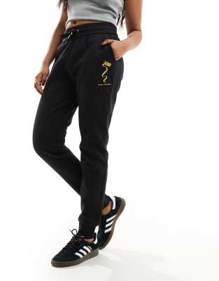 Armani Exchange - Jogginghose in Schwarz mit Drachenprint