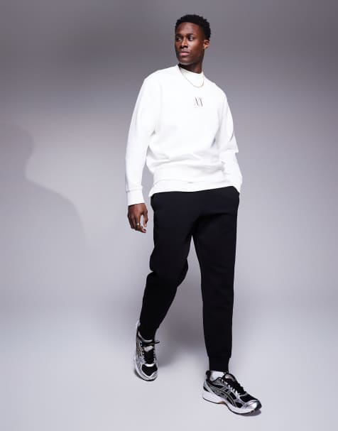 Armani Exchange – Jogginghose in Schwarz mit Logobündchen - view 1