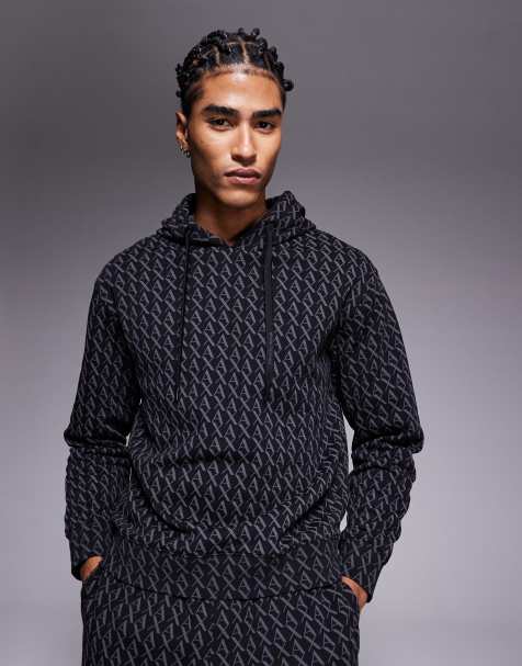 Armani Exchange – Kapuzenpullover in Schwarz mit Logomuster, Kombiteil - view 1