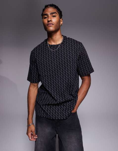 Armani Exchange – Kurzärmliges T-Shirt in Schwarz mit All-over-Logo - view 1