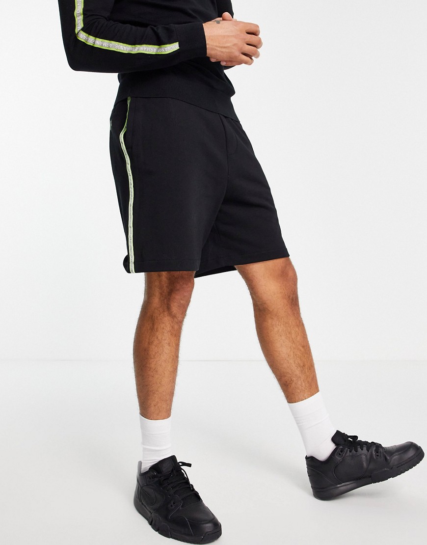 Armani Exchange neon logo shorts in black